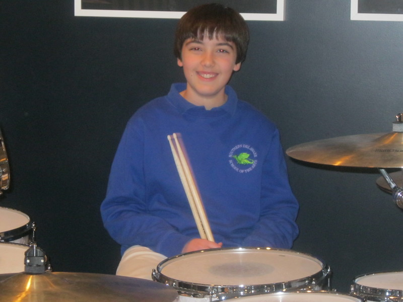 Justin Fisher behind his drum kit. The 12-year-old Lewes native plays with his own band, Parental Guidance. BY RYAN MAVITY